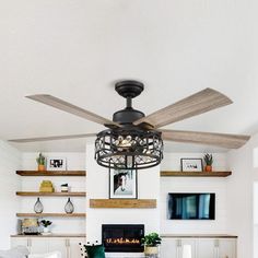 a living room filled with furniture and a fire place next to a wall mounted tv