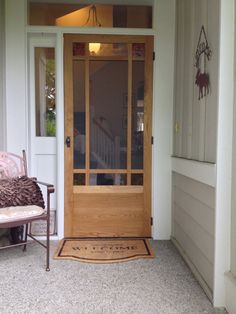 a wooden door with glass on the side of it and a bench in front of it