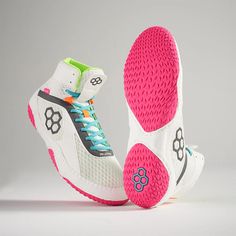 a pair of white and pink tennis shoes