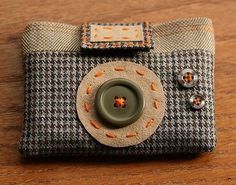 a small camera sitting on top of a wooden table