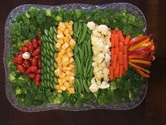 a platter filled with lots of different types of vegetables