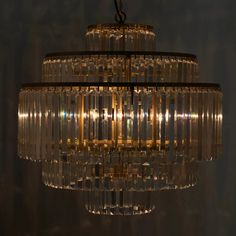 a chandelier hanging from the ceiling in a dark room