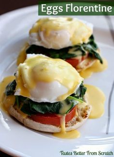 an egg and tomato sandwich on a white plate