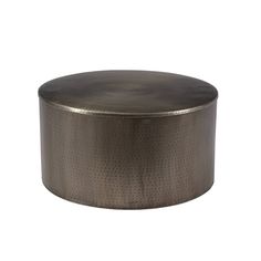 a round metal container with holes on the top and bottom, sitting against a white background