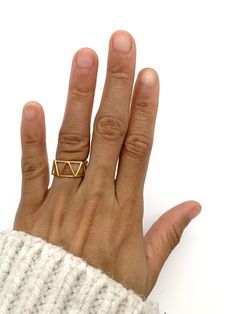 Gold Triangle Ring made of Gold Vermeil: 18k Gold over Solid 925 Sterling Silver ☞ made to last.Matching Earrings & Pendant - please ask me Details: • Minimalist Triangle Ring • Dimensions: Band width ≈ 9mm, thickness ≈ 1mm • 18k Gold Vermeil SKU R1010010335 Gold Triangle Jewelry For Anniversary, Minimalist Geometric Rings For Gifts, Minimalist Triangle Jewelry For Anniversary, Sterling Silver Triangle Rings For Gifts, Sterling Silver Triangle Rings As Gift, Adjustable Geometric Rings For Gifts, Adjustable Geometric Rings As Gift, Triangle Ring, Gold Triangle