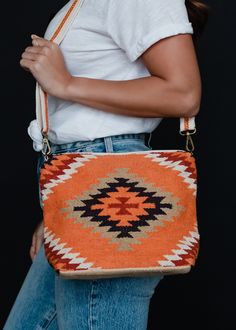 "A new bag is always a good idea! This orange and multicolored Aztec inspired crossbody is the perfect option for your casual everyday outings this season. Orange, white, red, black and green Aztec inspired crossbody bag Removable strap Measures 8\" x 12\" x 4\" Designed in the U.S.A. Produced in India. 100% Cotton Lining: 100% Polyester" Orange Pouch Bag For On-the-go, Orange Travel Bag With Adjustable Strap, Casual Orange Shoulder Bag For On-the-go, Orange Pouch Shoulder Bag With Cell Phone Pocket, Casual Orange Crossbody Shoulder Bag, Orange Bags With Cell Phone Pocket For Daily Use, Orange Crossbody Shoulder Bag For On-the-go, Orange Tote Shoulder Bag For On-the-go, Orange Pouch Shoulder Bag For Daily Use