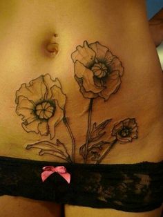 a woman's stomach with flowers on it