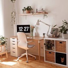 a home office with plants on the desk and shelves above it that are labeled 1237