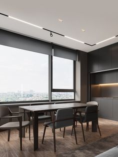 an empty conference room with large windows overlooking the city