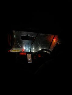 the interior of a car at night with its lights on