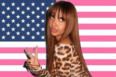 a woman holding up her peace sign in front of an american flag background with stars and stripes