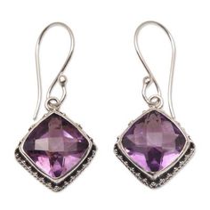 Named Pura the Indonesian word for temple these dangle earrings from Bali feature six carats of gleaming purple amethyst stones framed with intricate sterling silver. Working with local artisans Komang Wijayana presents the earrings. Classic Purple Drop Earrings, Traditional Purple Jewelry For Formal Occasions, Classic Purple Gemstone Earrings, Classic Amethyst Drop Earrings, Classic Amethyst Drop Earrings Jewelry, Faceted Purple Earrings, Traditional Purple Drop Earrings, Traditional Purple Teardrop Jewelry, Classic Purple Jewelry With Matching Earrings