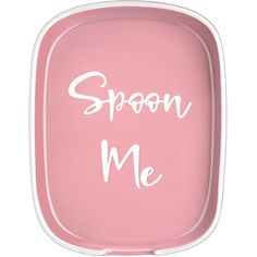 a pink tray with the words spoon me written in white ink on it's side