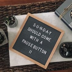 there is a sign that says sunday should come with a pause button on the table