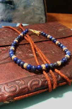 This bracelet is elegantly accented with gold glass beads to make the gold in the lapis lazuli stand out.  Lapis Lazuli is a dark blue crystal with flecks of pyrite in it. It is a stone used for wisdom and truth. It aids in intellectual analysis and good judgement. This stone is typically used for the third eye.  It measures at 7.5 inches.  If you have any questions, please feel free to contact me.  Thanks! :) Gold Glass, Blue Crystals, Third Eye, Gold Beads, Gold Accents, Lapis Lazuli, Arm Band, Cali, Glass Beads