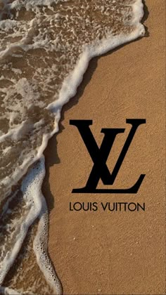 the logo for louis vuitton is shown in the sand at the edge of the water