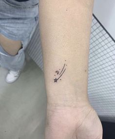 a person with a small tattoo on their wrist