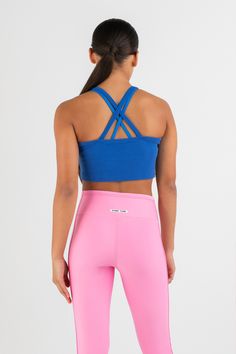 Introducing the Everyday Rib Singlet in Atlantic Blue—an essential style made for everyday wear. Designed in a cropped style with a high square neckline and a simple crossover strap detail on the back. Making it a cute little basic that’s so easy to wear that you could throw it on anytime with anything. Casual Crop Top With Built-in Bra And Strappy Back, Casual Cropped Sports Bra With Built-in Bra, Sporty Fitted Crop Top With Cross Back, Versatile Fitted Cross Back Sports Bra, Fitted Cross Back Sports Bra, Spring Versatile Cropped Sports Bra, Sporty Sports Bra With Multiple Straps, Blue Cropped Sports Bra For Summer, Fitted Strappy Back Crop Top