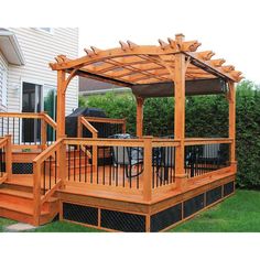 a wooden gazebo sitting on top of a lush green field