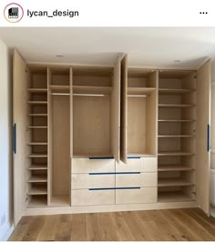 an empty room with wooden shelves and drawers