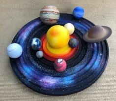 the solar system is made out of clay and painted with acrylic paint on it