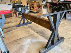 a workbench in a garage with tools on it