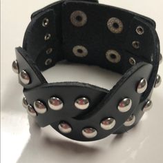 Black Leather Biker Bracelet Nwot Size Adjustable With Snaps 7.25 To 8.25 Inches Color Black Leather Thank You For Stopping By My Closet. Have A Great Day! Edgy Black Metal Cuff Bracelet, Punk Black Bracelet With Silver Studs, Punk Style Silver Bracelet With Studs, Silver Punk Bracelets With Studs, Edgy Black Metal Wristband, Silver Leather Punk Bracelet With Black Band, Punk Style Silver Leather Bracelet With Black Band, Silver Leather Bracelet With Black Band In Punk Style, Black Bracelets With Rivets As Gift