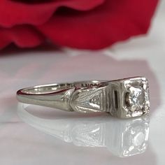 Details: Sweet classic Art Deco diamond ring--this one would make a great engagement ring or just a sweet ring to add to a collection. Would also be a great pinky ring! Please ask all necessary questions prior to placing an order. Measurements: The size is 4 1/2 US, and can be sized for a fee. Condition: The overall all condition of this ring is very good. Formal Asscher Cut Diamond Birthstone Ring, Asscher Cut Cluster Ring For Anniversary, Formal Single Diamond Ring, Timeless Anniversary Birthstone Ring, Heirloom Diamond Cut Cluster Ring For Promise Occasion, Diamond Asscher Cut Ring For Anniversary, Vintage Engraved Ring With Single Diamond For Anniversary, Heirloom Diamond White Cluster Promise Ring, 14k White Gold Emerald Cut Promise Diamond Ring