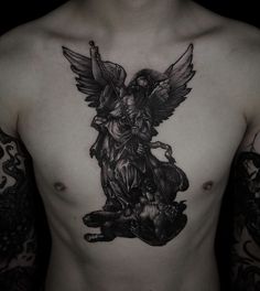 the back of a man's chest with an angel tattoo on it