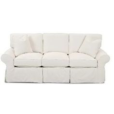 a white couch with pillows on it