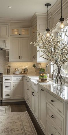 a large kitchen with white cabinets and marble counter tops, along with an area rug on the floor