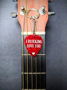 Acrylic laser cut guitar picks keychain. Makes a great gift for an anniversary , a wedding day gift or something to grab someone just because you love them! The pick comes in two different colors, marble red and marble brown. These are not real guitar picks, they are cut from acrylic and are very durable. Lightweight. Measures at 1.5 inches long.  What to customize it to say whatever you like? Reach out to us and let us know? We'd love to do a custom listing for you! Musician Boyfriend, Guitar Pick Keychain, Acrylic Laser Cut, Guitar Gifts, Guitar Picks, Guitar Pick, Anniversary Gift, Wedding Gift, Keychains