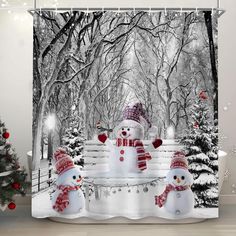 two snowmen are standing in front of a christmas tree shower curtain set with lights