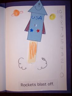 an open children's book with a rocket and stars on the cover that says rockets blast off