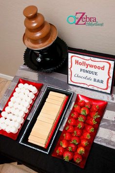 a table topped with desserts and marshmallows