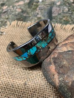 *  King Man Turquoise Inlay. *  Heavy stainless cuff Bracelet.  4 X 26 mm Thick and Wide. *  Polished and Waxed. *  Measure your whole wrist and mark it on the option. * 7.5" Wrist has 4 oz in weight. Kings Man, Granada, Cuff Bracelet, Cuff Bracelets, Jewelry Bracelets, Wax, Cuff, Turquoise, Bracelet