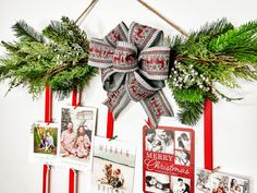 a christmas wreath with pictures and ribbons hanging on a white wall next to other holiday cards