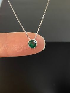 "Tiny Sterling Silver Emerald CZ Slider Pendant Necklace Simple Necklace / Minimalist Necklace / Dainty Necklace Metal: All components are made from solid .925 Sterling Silver Stone: Cubic Zirconia Pendant Width: 6mm Chain Length: adjustable from 16\" to 18\" You can enter my storefront here https://www.etsy.com/shop/LinksAndStones Please feel free to Convo me with any questions before purchasing. Please view policy before purchasing Thank You For Visiting My Shop" Dainty Round Emerald Necklace In Sterling Silver, Dainty Silver Emerald Necklace, Dainty Sterling Silver Round Emerald Necklace, Emerald Necklace Simple, Everyday Minimalist Green Necklace, Dainty Silver Pendant Emerald Necklace, Minimalist Green Emerald Gemstone Necklace, Short Silver Necklace, Emerald Necklace Pendant