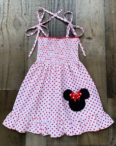 White Red Polka Dot Minnie Mouse Dress Playful Minnie Mouse Summer Dress, Minnie Mouse Fitted Sleeveless Dress, White Minnie Mouse Summer Dress, Minnie Mouse Sleeveless Fitted Dress, Sleeveless Minnie Mouse Dress For Spring, Cute Fitted Sleeveless Smocked Dress, Casual Minnie Mouse Summer Dress, Spring Casual Minnie Mouse Dress, Casual Summer Dress With Minnie Mouse Design