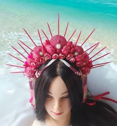 Hot pink mermaid crown for adult is absolutely lovely and would be lovely for a photoshoot, beach wedding, or mermaid costume adult, burning man clothing for women, mermaid festival crown, siren cosplay or mermaid cosplay. This Siren headpiece will be an excellent complement to mermaid party outfit for women. DIMENSIONS: - This Seashell crown is suitable for adults. - The height of the spiked is about 5.6 inches (13 cm). - The spikes are made with wood. The spikes are painted with hot pink acrylic paint. - The crown is decorated with rhinestone, beads and natural shells. - The crown on the head can be secured with a ribbon. - This crown is beaded and decorated with strings of beads that I collected by hand. - This crown is unique, made in one instance. 100% repetition is not possible. Only Bohemian Teardrop Crown For Festivals, Pink Beach Headband Hair Accessory, Pink Beach Headband, Pink Headband For Beach, Bohemian Crown For Festival With Structured Shape, Bohemian Headpieces For Beach Summer, Adjustable Pink Crown With Round Shape, Adjustable Pink Costume Hat For Carnival, Pink Adjustable Costume Hat For Carnival