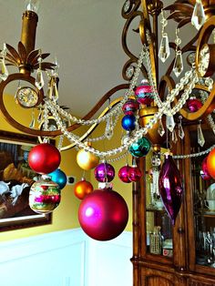 a chandelier with ornaments hanging from it