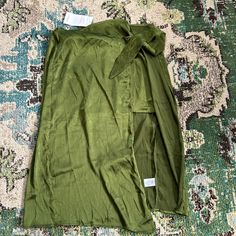 Green Midi/Mini Skirt Silky Size Xs Never Worn Solid Rayon Skirt For Summer, Spring Green Skirt With Tie Waist, Green Asymmetrical Skirt For Beach, Green Asymmetrical Skirt For The Beach, Casual Wrap Skirt For Spring, Casual Wrap Skirt For Summer, Casual Green Split Skirt, Casual Wrap Skirt, Spring Wrap Bottoms With Lined Skirt