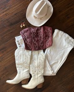 The hottest country concert outfit starts with our Dark Red Faux Leather Embroidered Western Cowboy Corset Top! This dark red corset top features a strapless neckline, lace up back, cropped hem, and western-inspired stitching that's as fiery as you. Pair with your favorite cowboy boots and denim skort. Ccmf Outfit Ideas, Red Cowgirl Costume, Cowgirl Going Out Outfits, Country Music Outfits Concert, Western Corset Outfit, Hudson Westbrook, Cowgirl Christmas Outfit, Ccmf Outfits, Cowboy Inspired Outfit