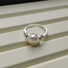 🤍 Gorgeous looking!! Freeform Style Cultured Pearl Ring. Metal: 925 Sterling Silver. Stones: Cultured Pearl, CZ Ring Size: Can be selected Stone Size: 8 mm Total Weight: 2.6 grams Anti-tarnishing coated 🤍  Add a touch of elegance to your jewelry collection with this stunning pearl ring. Crafted from 925 sterling silver, this ring features a cultured off white pearl stone accentuated with sparkling cubic zirconia. The round shape of the pearl and cubic zirconia its excellent cut grade make it a Elegant 925 Stamped Pearl Promise Ring, White Pearl Drop Ring For Anniversary, Elegant Sterling Silver Pearl Ring Stamped 925, Wedding Pearl Ring Stamped 925 In Sterling Silver, Wedding Pearl Ring In Sterling Silver, Stamped 925 Pearl Ring For Wedding, Wedding Pearl Ring Stamped 925, Fine Jewelry Silver Pearl Ring, Pearl White Open Ring For Anniversary