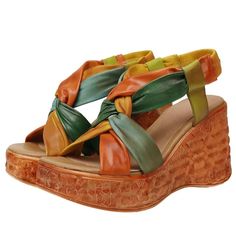 These Lorena Wedges by USS Shoes are crafted from genuine cow leather for an elegant look. These gladiator-style sandals feature a mixed color pattern and a supportive wedge heel, making them perfect for any dressy occasion. The elastic band closure and soft pigskin lining provide a comfortable and stylish fit. Elevate your summer wardrobe with this high-quality, sophisticated piece. Green Leather Wedge Sandals For Vacation, Leather Bohemian Wedge Sandals, Bohemian Leather Wedge Sandals, Bohemian Leather Wedge Sandals For Spring, Multicolor Leather Wedge Sandals For Summer, Green Leather Wedge Sandals For Beach, Bohemian Leather Sandals With Wedge Heel, Bohemian Leather Wedge Heel Sandals, Casual Multicolor Leather Wedge Sandals