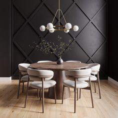 a dining room table with white chairs around it