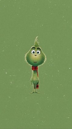 an image of a green creature with big eyes and a red scarf on his neck