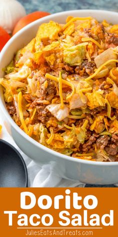 a bowl filled with taco salad next to an orange and white plate full of vegetables