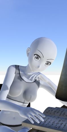 an alien sitting in front of a computer screen