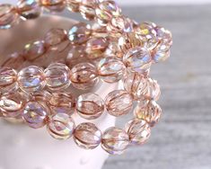 Add a touch of elegance to your jewelry creations with these 8mm beads. They feature a beautiful shimmer, reminiscent of champagne bubbles. Their faceted melon round shape, enhanced with a platinum finish, gives them a unique and attractive look. Ideal for any crafting project, these beads will surely make your designs stand out. Czech glass beads are known for their sparkling cuts and vibrant colors. The art of glassmaking dates back to Roman times. From the earliest days, Czech glassmaking set Champagne Bubbles, 8mm Beads, Beads Online, Bead Store, Crystal Ab, Glass Crystal, Jewelry Creation, Czech Glass Beads, Crystal Glass